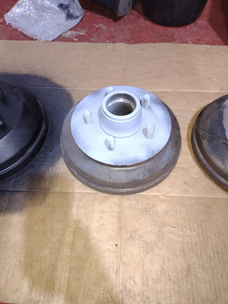 Trailer hub and brake drum cleaned during overhaul