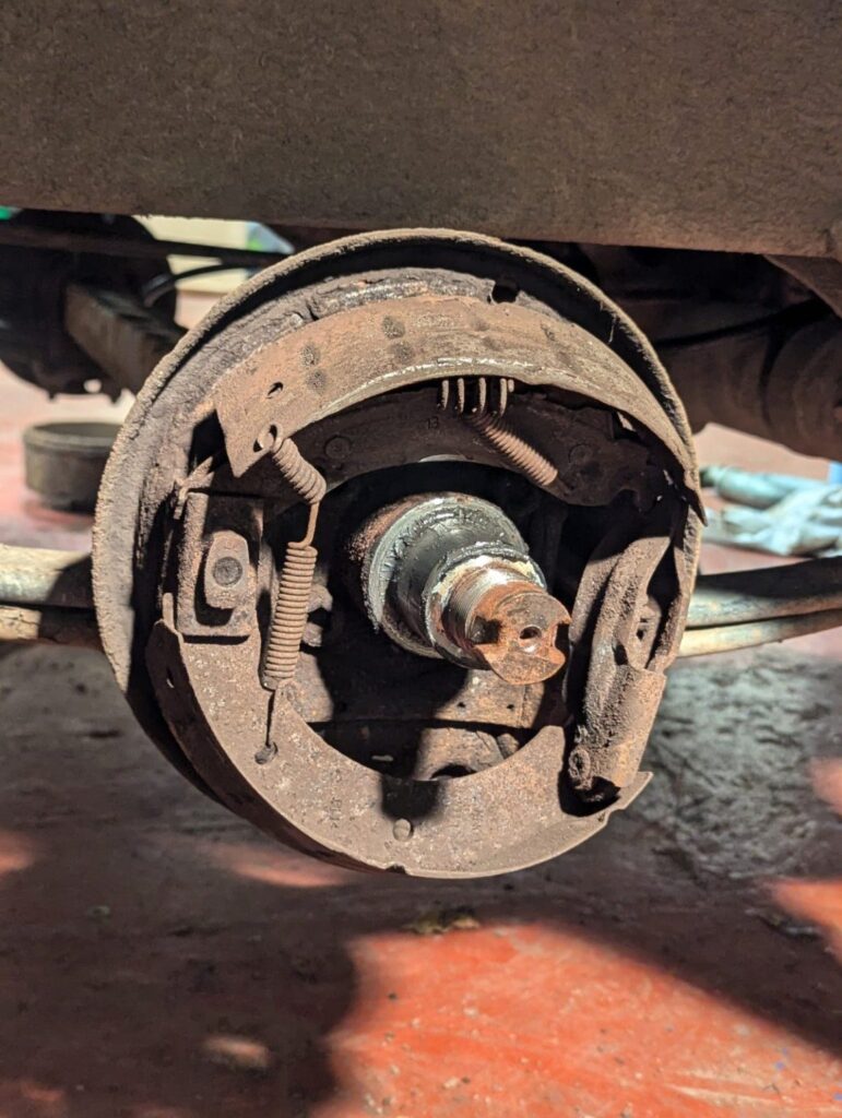 Corroded trailer brake assembly exposed during servicing